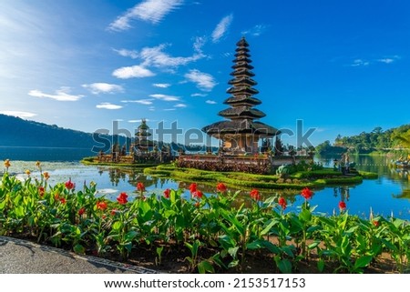 Pura Ulun Danu, Hindu temple surrounded by flowers on Bratan lake, Bali. Royalty-Free Stock Photo #2153517153
