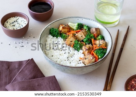 Rice with tofu, broccoli, carrots and sesame. Healthy eating. Vegetarian food Royalty-Free Stock Photo #2153530349
