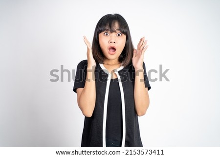 portrait of young asian woman feeling shocked and suprised over isolated background Royalty-Free Stock Photo #2153573411