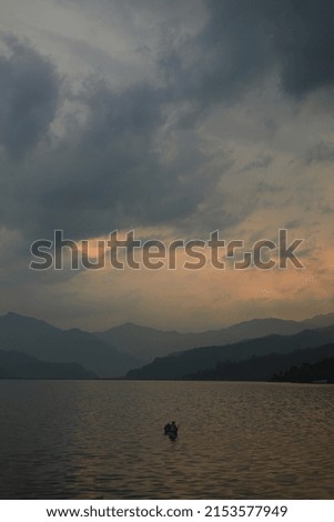 A fisher man rowing boat on the fewataal during the golden hour 