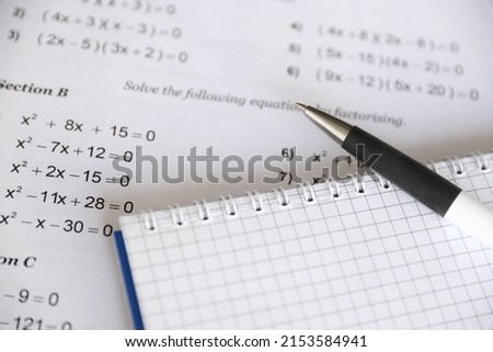 Handwriting of mathematics quadratic equation on examination, practice, quiz or test in maths class. Solving exponential equations background concept. Royalty-Free Stock Photo #2153584941