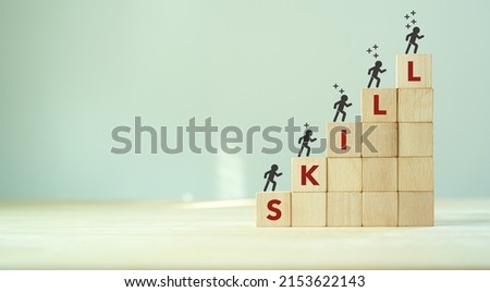 Upskilling and personal development concept. Skill training, education, learning, ability, knowledge and competency  for digital transformantion. Upskilling, reskilling, new skills icon on wooden cube