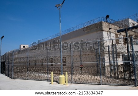 San Pedro California Federal Correctional Institution Terminal Island prison exterior. Prison fence and razor wire  Royalty-Free Stock Photo #2153634047