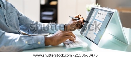 Business Accountant Using Electronic Bill On Laptop Computer Royalty-Free Stock Photo #2153663475