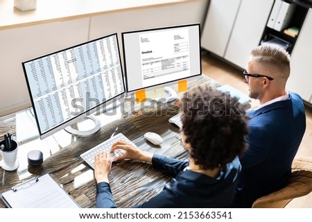 Analyst Working With Spreadsheet On Computer Screen