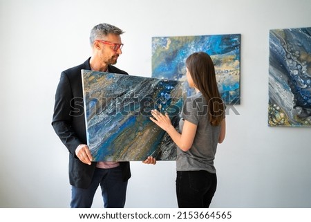 Art Painting Exhibition. Looking To Buy Modern Artwork In Gallery Royalty-Free Stock Photo #2153664565