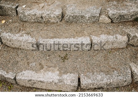 Antique, old stairs made of gray stone, brick close-up. Photography of architecture.