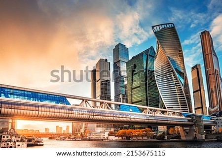 Modern glass skyscrapers against the sky at sunset. Moscow city, Russia. Blue sky with clouds and glass facades of skyscrapers  Royalty-Free Stock Photo #2153675115