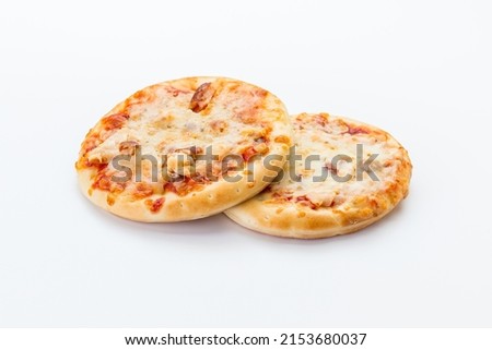Two Italian mini pizzas on a white background Royalty-Free Stock Photo #2153680037