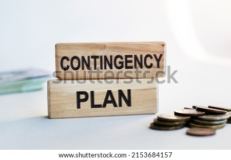 The inscription CONTINGENCY PLAN on wooden cubes isolated on a light background. Concept word forming on wooden cube. Business, economics and finance concept. Royalty-Free Stock Photo #2153684157