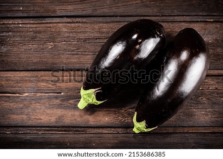 Fresh homemade eggplant on the table. On a wooden background. High quality photo