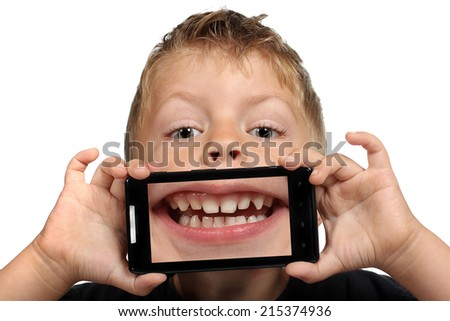 Cute little boy having fun with a selfie mouth on a white background