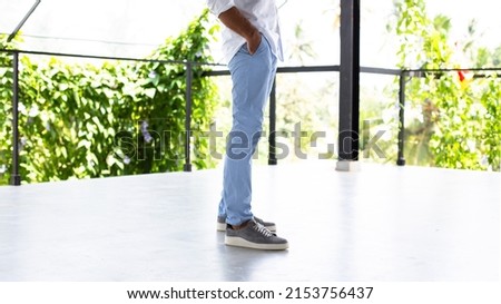Men's blue cotton chino trousers. Royalty-Free Stock Photo #2153756437