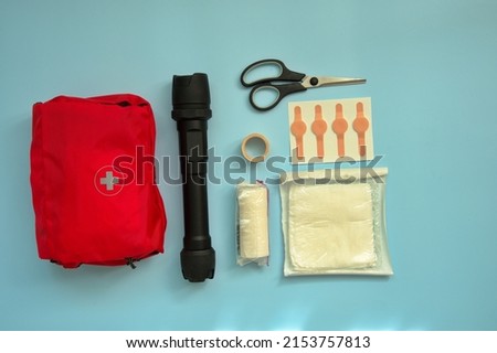 Directly above shot of first aid kit against blue background
