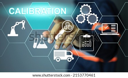 Lab instrumentation engineer or technician pointing to click touch press to activate calibration icon intermediate check or calibration. Annual cycle of machinery in the industrial linking document Royalty-Free Stock Photo #2153770461