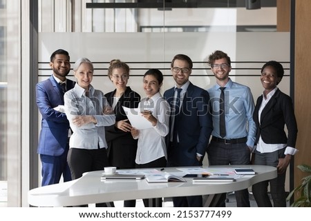 Successful diverse business team of multiethnic employees corporate portrait. Group of happy coworkers, students, interns, mentors standing, looking at camera, smiling. Teamwork, diversity concept