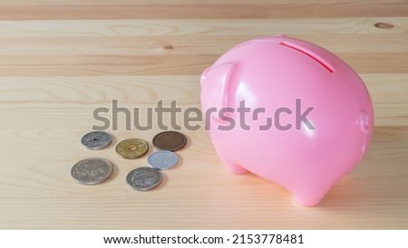 Piggy bank and coins. Japanese coins.