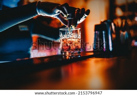 woman bartender hand making cocktail in nightclub Royalty-Free Stock Photo #2153796947