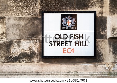 Street sign for Old Fish Street Hill, London, with the ancient coat of arms, which dates back to 1361, for the City of London. Space for your text.