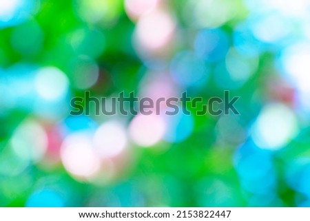 Blurred bokeh of a flower and tree for background.