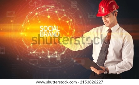 Handsome businessman with helmet drawing