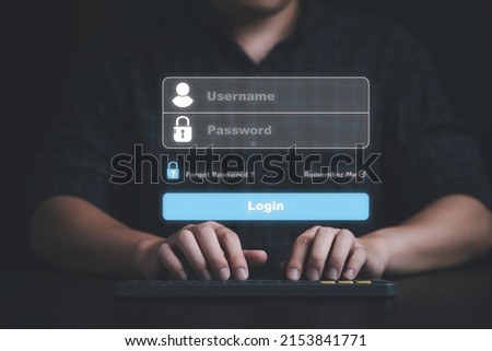 Businessman typing on keyboard laptop computer to input username and password for technology security system and prevent hacker concept. Royalty-Free Stock Photo #2153841771