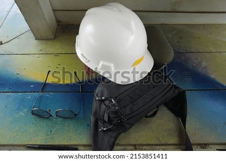 are safety helmets, goggles and small bags, are tools that are often used by coal mining supervisors