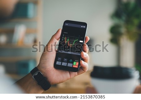 planning and strategy, Stock market, Hands of business people working with smart phone. Technical price graph and indicator, red and green candlestick chart and stock trading mobile screen background.