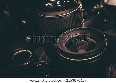 Photo Lenses Kit. Professional Photography Lenses Closeup. Dark Brown Color Grading.