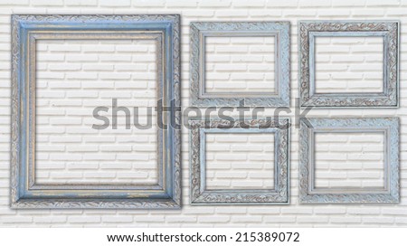 photo frame  on white brick wall 