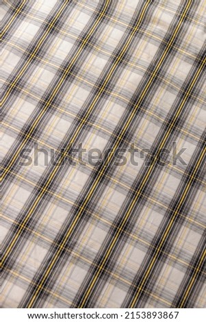 Classic geometric plaid fabric in gray and yellow
