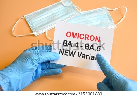 Covid-19 new variants of Omicron. Doctor's hand in blue glove and writing "Omicron BA.4-BA.5 Variant" on white sheet. Concept for the new Covid 19 Omicron variants Royalty-Free Stock Photo #2153901689
