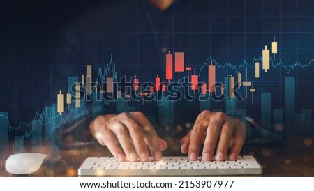 Businessman hand use computer analyze graph for trade stock market on the screen. Businessman hand use keyboard check chart graph stock of growth. Hand man stock graph chart point of target success.