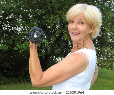 Woman doing sports with dumbbell