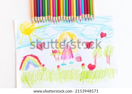 A child draws a postcard for mother's day. Beautiful landscape with mom drawn with pencils.