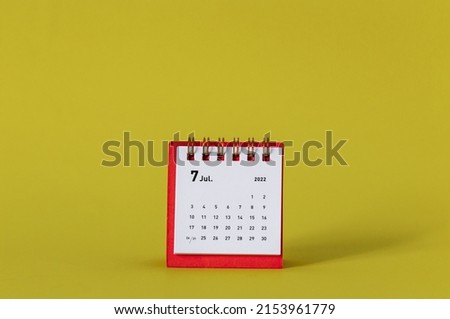 Desktop mini calendar for July 2022 on a yellow background