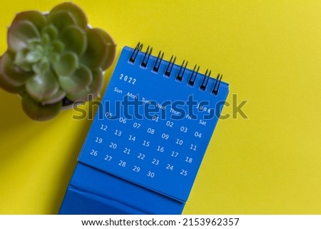 Desktop calendar for June 2022 on a yellow background Royalty-Free Stock Photo #2153962357