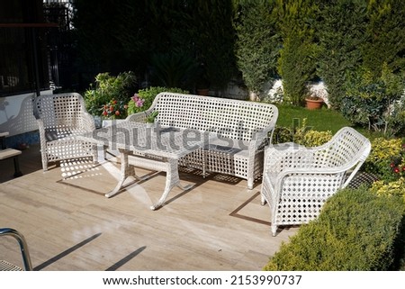 garden tables and wicker chairs