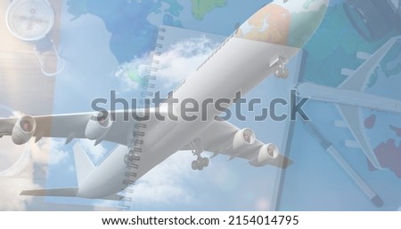 Multiple image of diary, map, navigational compass on table and airplane flying against sky. digital composite, planning, guidance, travel, aviation, patriotism, celebration and awareness concept. Royalty-Free Stock Photo #2154014795