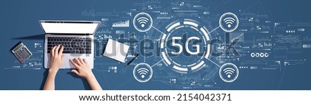 5G network with person using a laptop computer