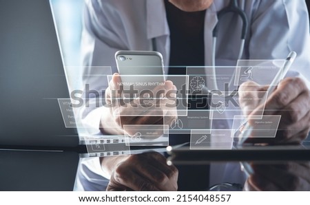 Electronic health record system EHRs, medical technology concept. Doctor working on digital tablet and laptop computer with medical record and patient's information on virtual screen
