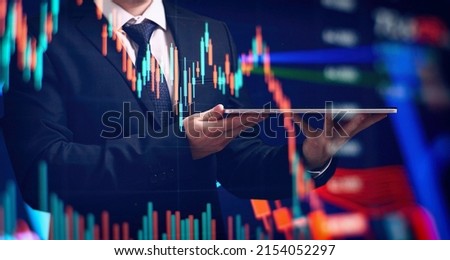 analyzes financial and investment data, planning business, finance and investment strategies on Business finance background.