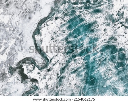 Frozen river. Icy snowy background. Aerial view