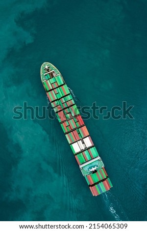 container ship carrying container box global business delivery service cargo by freight shipping commercial trade logistic and transportation over sea worldwide aerial top view photograph from drone 