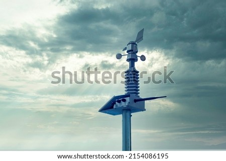 Automatic weather station, with a weather monitoring system. Against the background of a gray sky with clouds. soft focus. Royalty-Free Stock Photo #2154086195