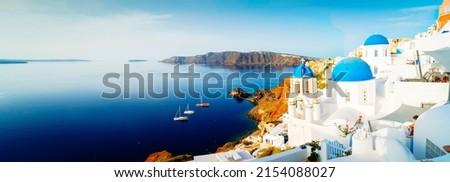 white church belfry, blue domes and volcano caldera with sea landscape, beautiful details of Santorini island, Greece, wide web banner format