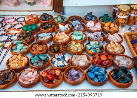 Natural, astrological stones in the bowl. A natural stone that gives strength that is good for health. Colorful candies in wooden bowl. Spiritual stone.
 Royalty-Free Stock Photo #2154093719