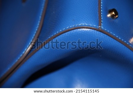 Smooth leather blue surface. Backgrounds