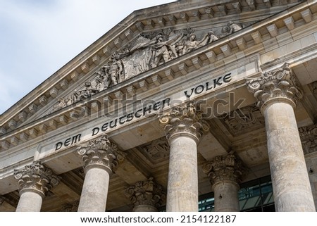 The Reichstag building (Bundestag) in Berlin, Germany, meeting place of the German parliament: The inscription says: Dem Deutschen Volke - To the German people Royalty-Free Stock Photo #2154122187