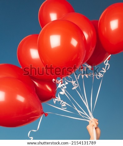 Closeup Photo of Many Red Balloons over Blue Sky Background. Happy Birthday Attribute. Festive Background.